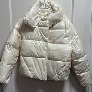 Cream puffer jacket.